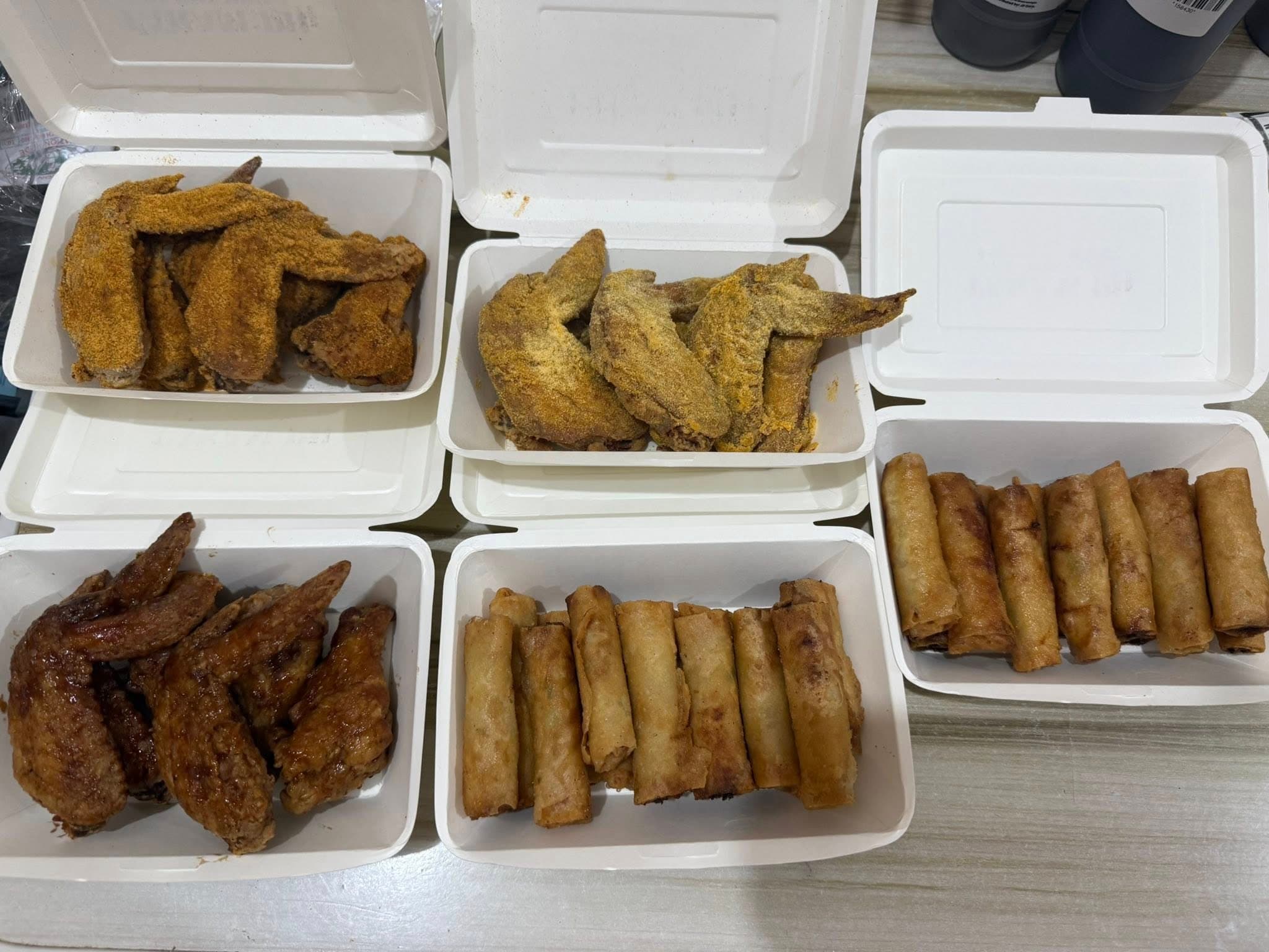 Takam PH boxes with wings and lumpia.