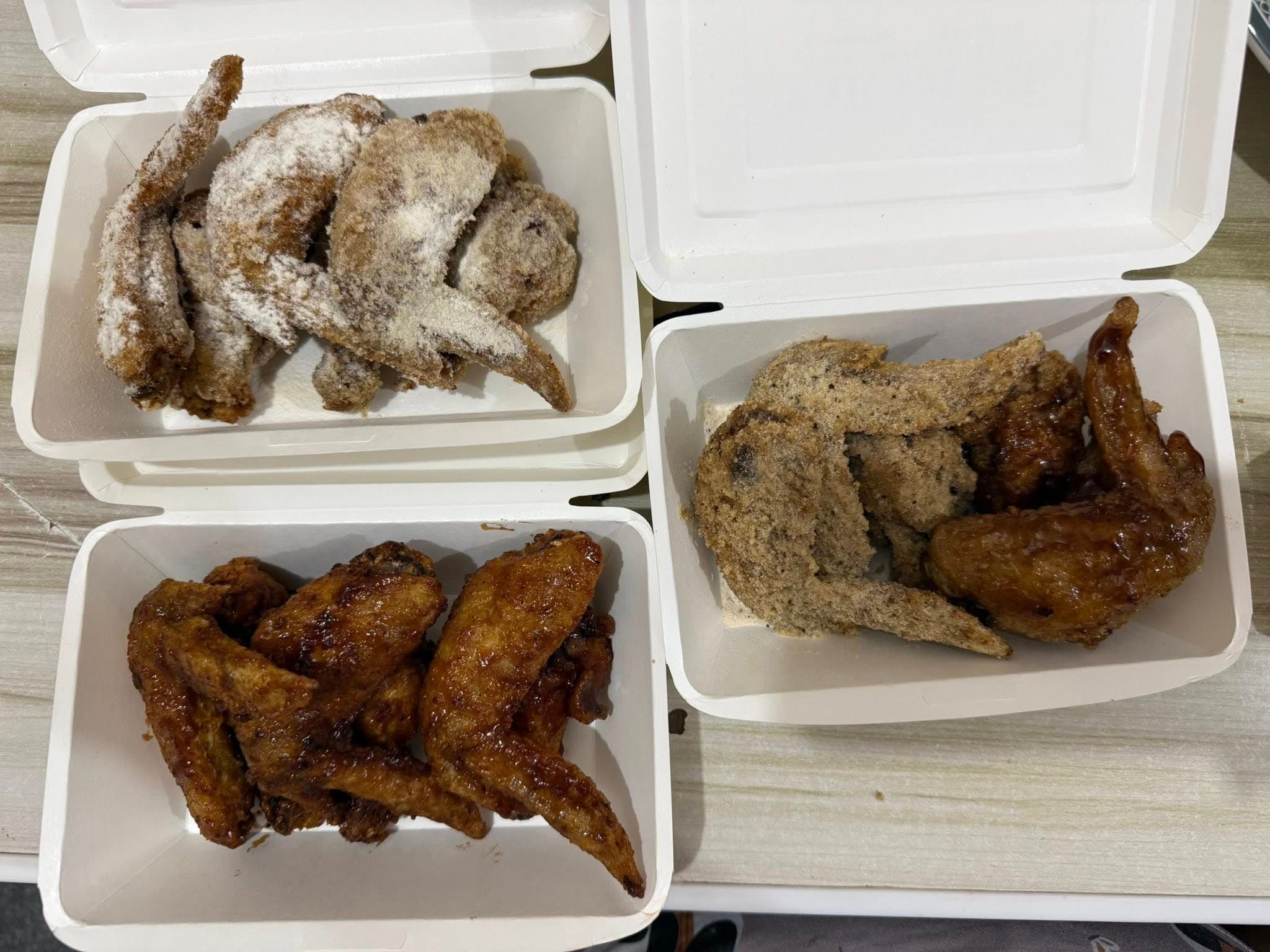 Takam PH mixed wing boxes with sauced and powdered wings.